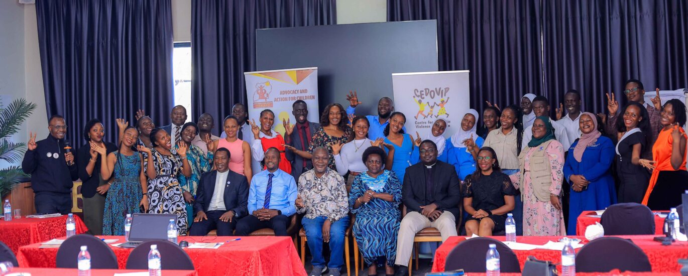 Stakeholders pause at a national stakeholder dialogue in Kampala