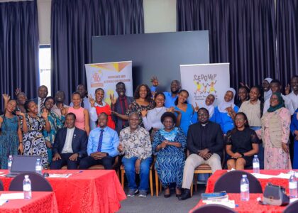 Stakeholders pause at a national stakeholder dialogue in Kampala